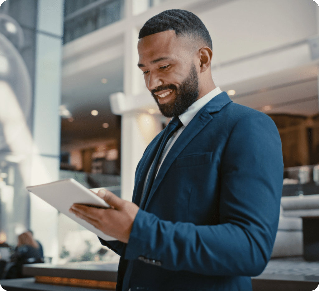 Man in Business Suit holding a tablet